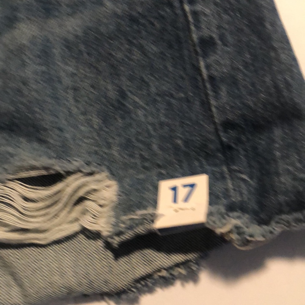 Woman’s distressed high rise button fly Jean shorts - Picture 6 of 9